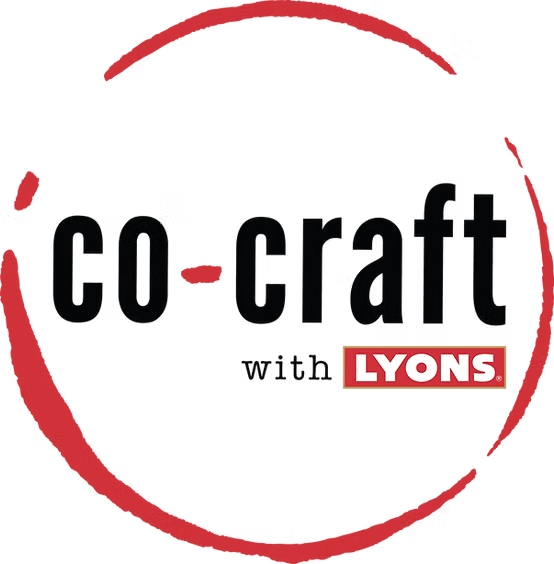 A logo-style graphic on a white background reading 'co-craft with LYONS' in black and red text, framed by a red brushstroke oval.